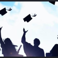 Graduating students throwing up their caps