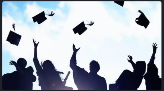 Graduating students, tossing their cap after graduation